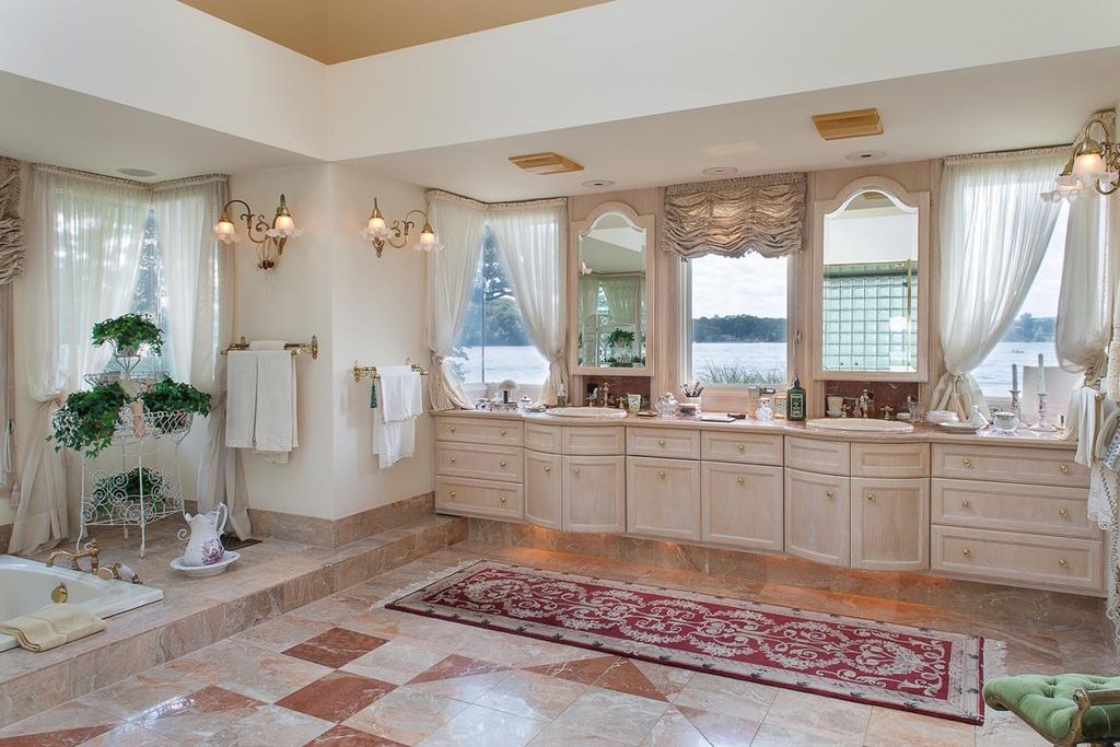 Traditional Master Bathroom with Simple marble counters, Framed Partial Panel, Bathtub, full backsplash, Double sink