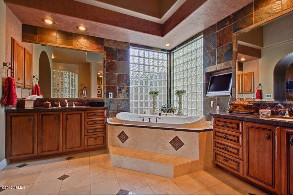 Craftsman Master Bathroom with Stone Tile, Complex granite counters, picture window, Flush, Bathtub, Undermount sink, Shower