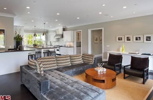 Contemporary Living Room with Built-in bookshelf, can lights, Concrete floors, Standard height