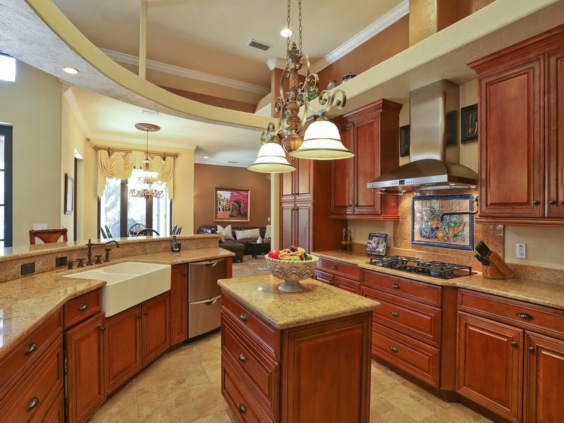 Traditional Kitchen with double dishwasher, Wall Hood, Casement, Breakfast nook, Concrete floors, Breakfast bar, Box ceiling