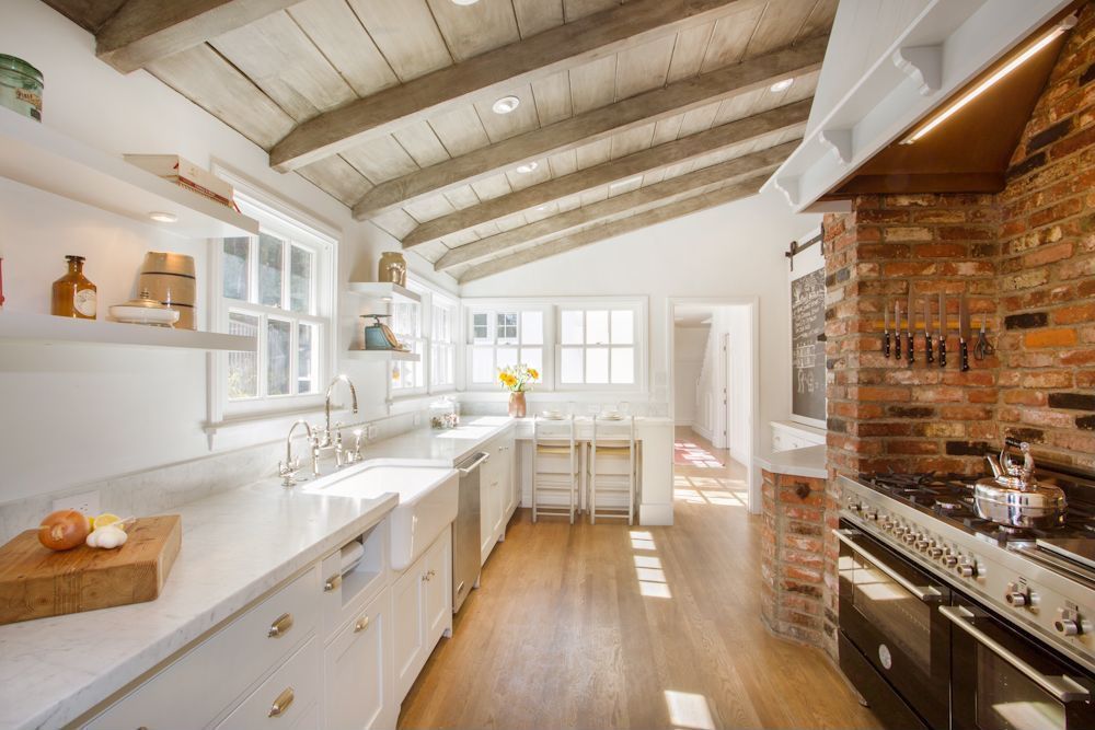 Country Kitchen with Belle foret apron front kitchen sink, U-shaped, Flat panel cabinets, White slim line floating shelf