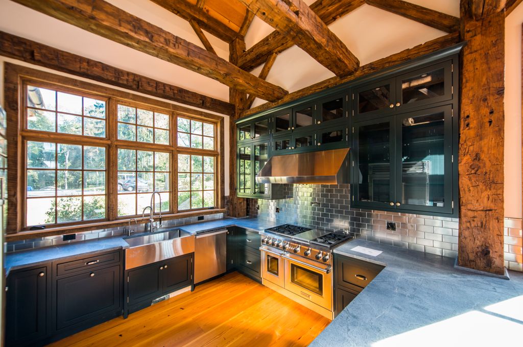 Rustic Kitchen with Wall Hood, Hardwood floors, Standard height, Exposed beam, U-shaped, Glass panel, Farmhouse sink