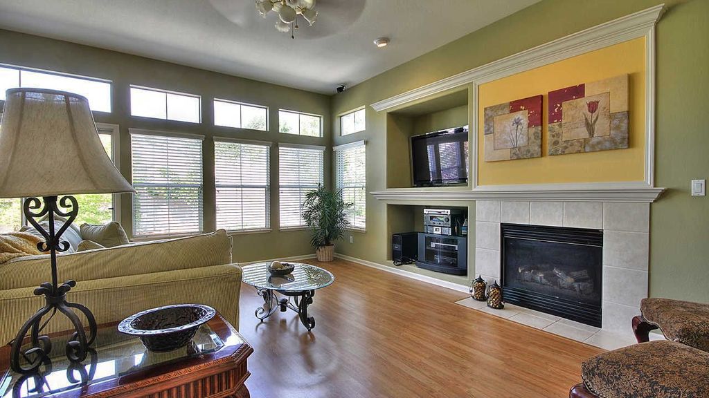 Contemporary Living Room with can lights, Standard height, French doors, insert fireplace, Ceiling fan, Hardwood floors