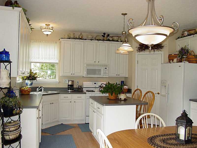 Country Kitchen with dishwasher, Stainless drop in double basin sink, White interior 6-panel door, built-in microwave