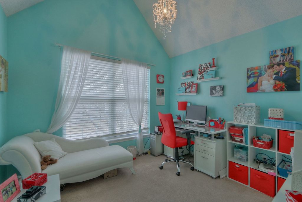 Eclectic Home Office with double-hung window, Carpet, Built-in bookshelf, Chandelier, High ceiling