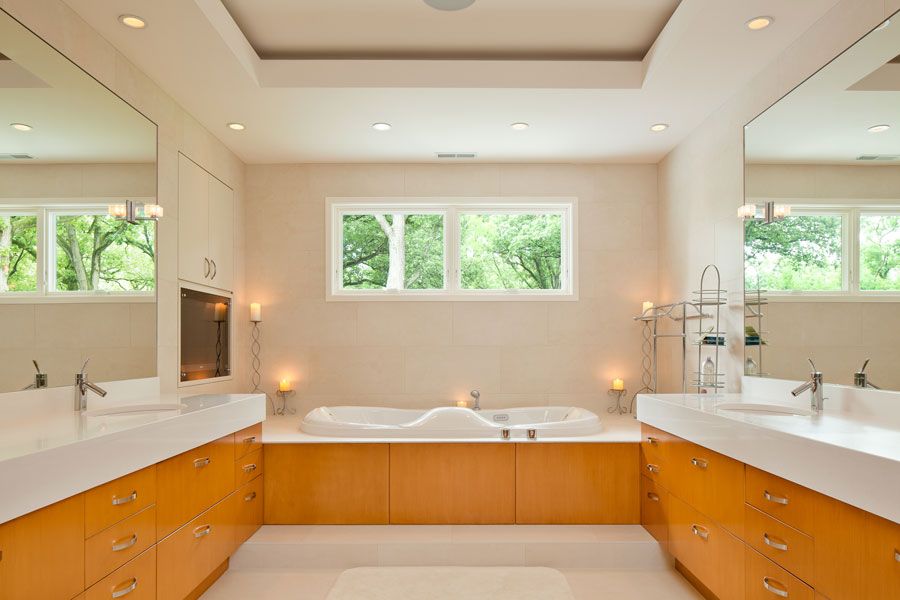Contemporary Master Bathroom with Standard height, Undermount sink, Wall Tiles, Flush, can lights, Corian counters, Casement