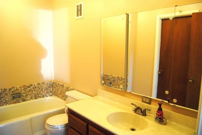 Traditional Full Bathroom with High ceiling, Bathtub, partial backsplash, Limestone, Inset cabinets, Undermount sink