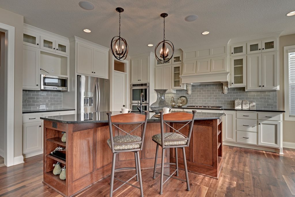 Craftsman Kitchen with double wall oven, can lights, Standard height, built-in microwave, Undermount sink, Glass panel, Paint