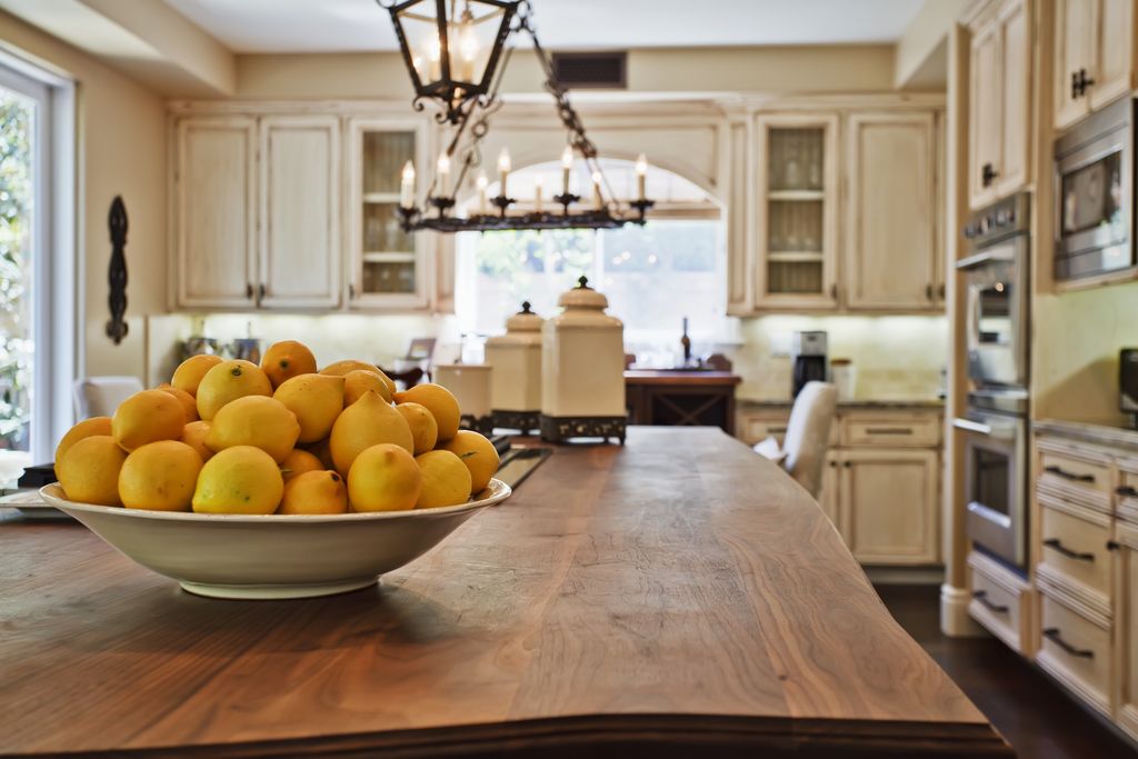 Country Kitchen with Pendant light, Glass panel, double wall oven, Flat panel cabinets, Standard height, Flush, Breakfast bar