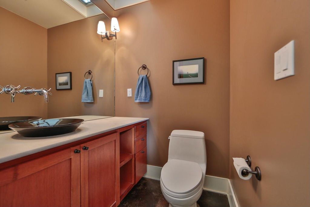 Contemporary Powder Room with Paint, slate floors, Standard height, Wall sconce, Powder room, European Cabinets, Vessel sink