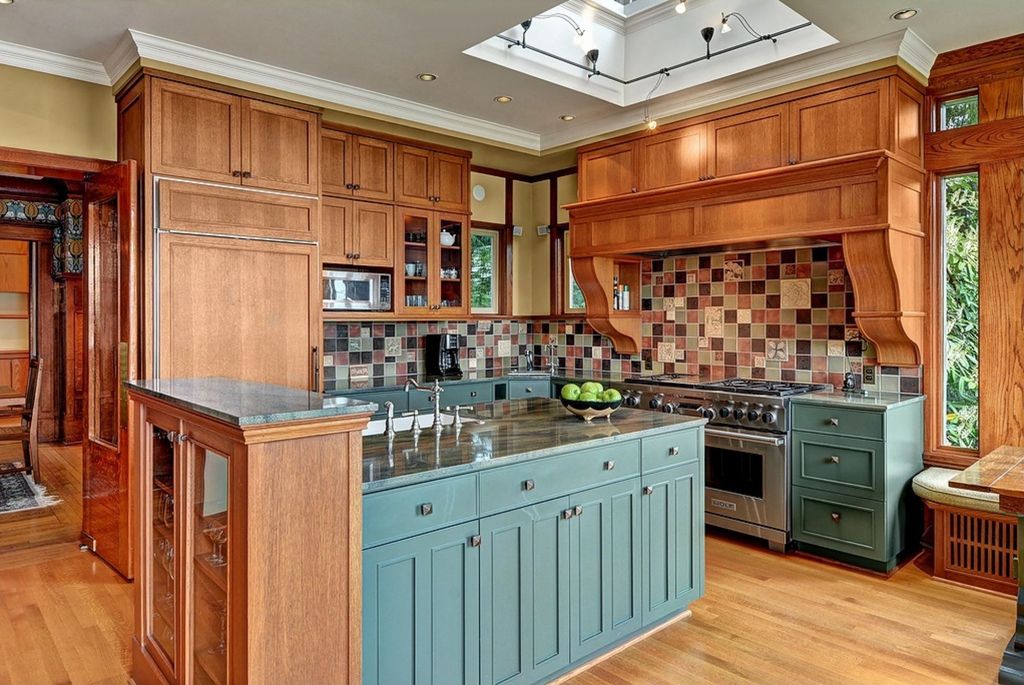 Craftsman Kitchen with Ceramic Tile, Complex granite counters, picture window, L-shaped, European Cabinets, Undermount sink