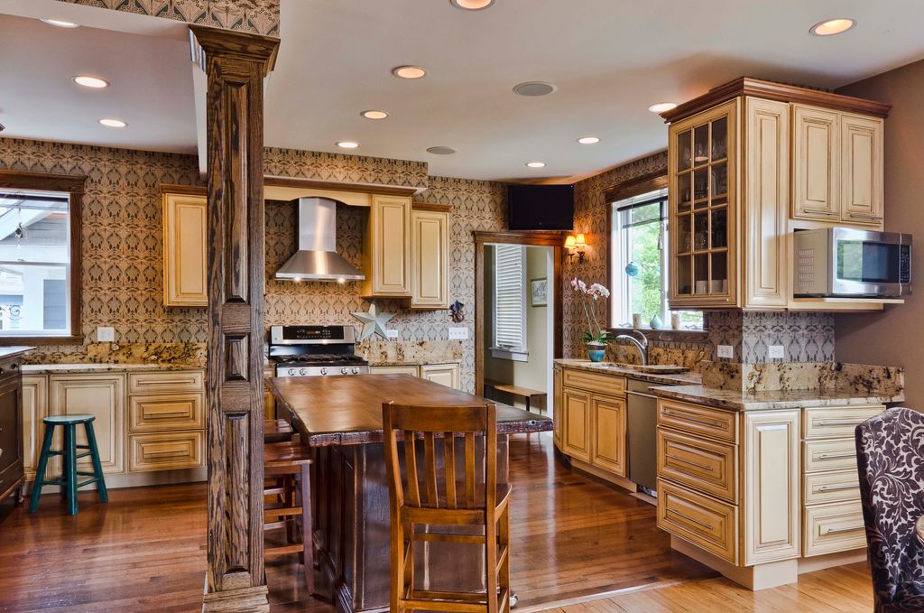 Country Kitchen with L-shaped, Complex Granite, can lights, interior wallpaper, Breakfast bar, dishwasher, Casement