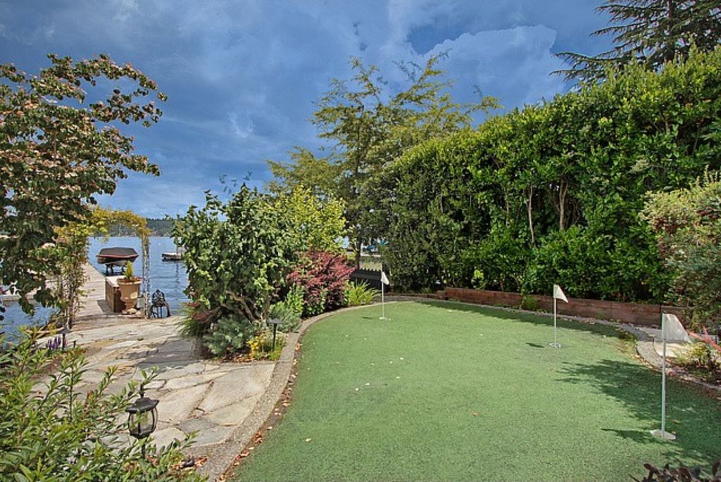 Eclectic Landscape/Yard with Fence, Raised beds, Pathway, Arbor, exterior stone floors