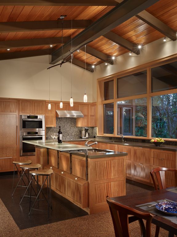 Contemporary Kitchen with Paint 1, electric cooktop, Kitchen island, Flat panel cabinets, full backsplash, can lights, Paint