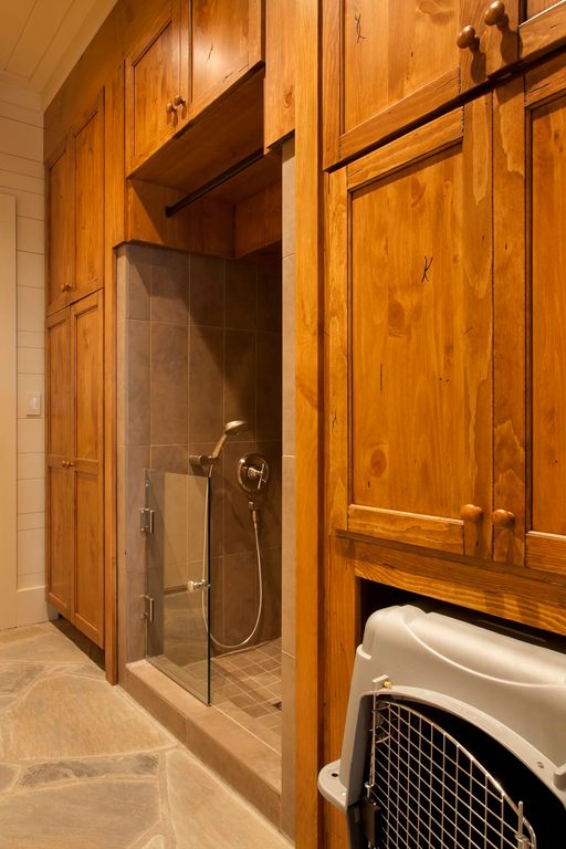 Craftsman Mud Room with limestone floors, Black Bear Manufactured Stone - Fieldstone Rustic / Fieldstone, Built-in bookshelf