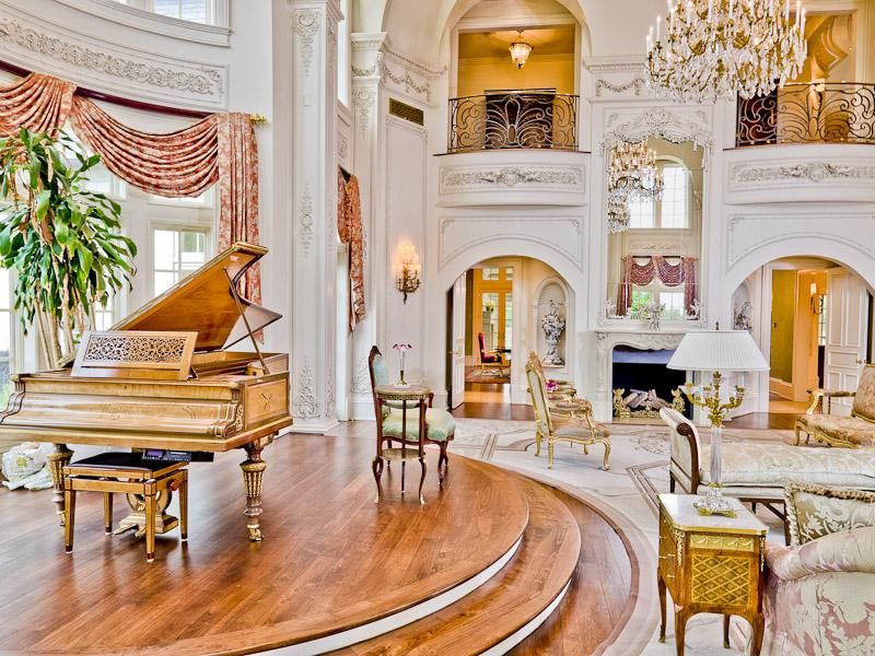 Traditional Living Room with double-hung window, Chandelier, Paint 1, Cathedral ceiling, Balcony, Crown molding, Wall sconce
