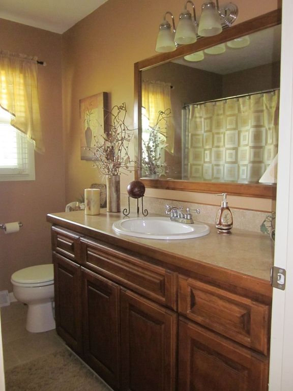 Traditional Full Bathroom with limestone tile floors, Drop-in sink, full backsplash, tiled wall showerbath, Shower, Casement