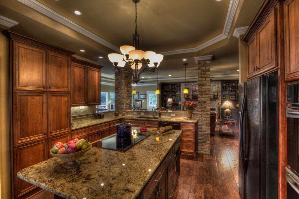 Country Kitchen with Galley, Paint, Capital lighting 9 light stanton large chandelier, Kitchen island, partial backsplash