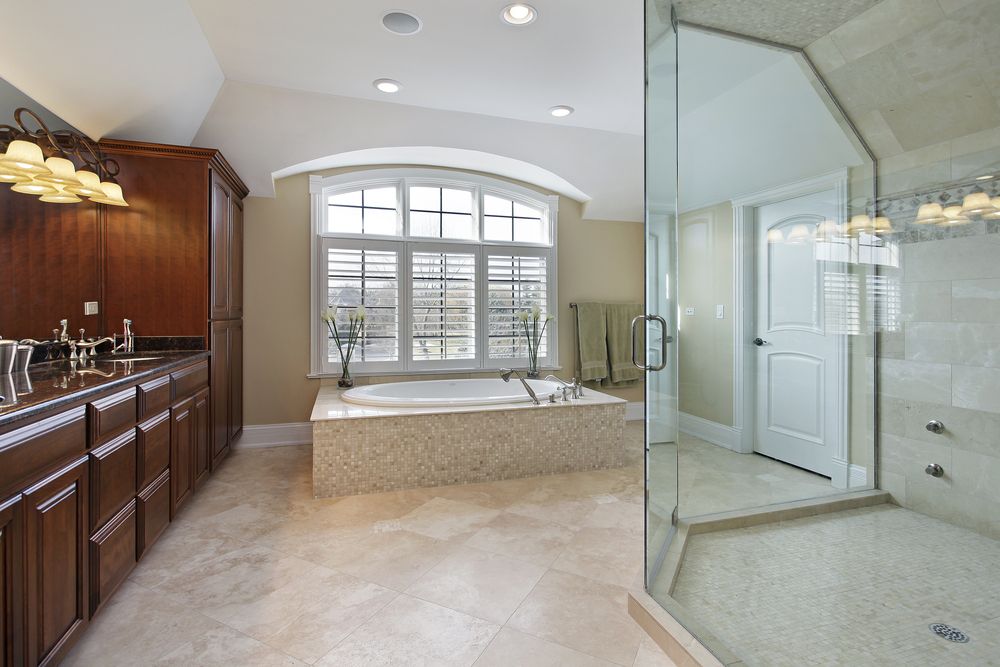 Traditional Master Bathroom with full backsplash, Bathtub, stone tile floors, drop in bathtub, Simple granite counters