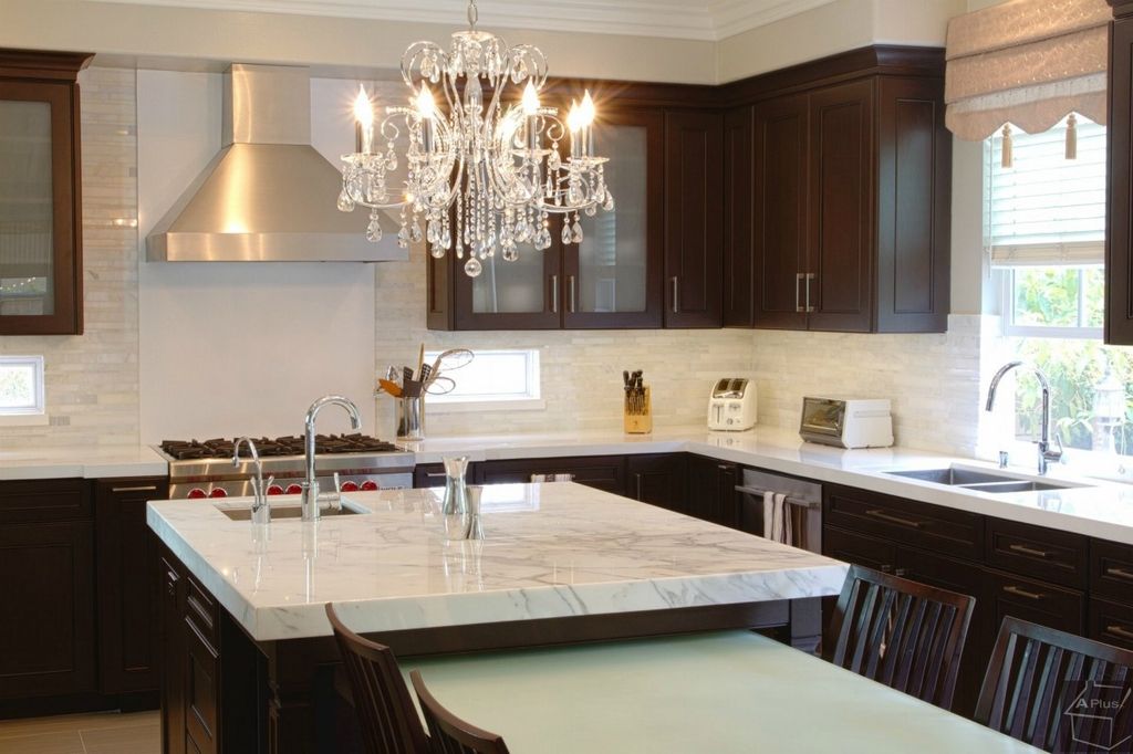 Contemporary Kitchen with Glass panel, Stainless undermount 2-basin sink, Chandelier, Carrara marble countertop, Limestone