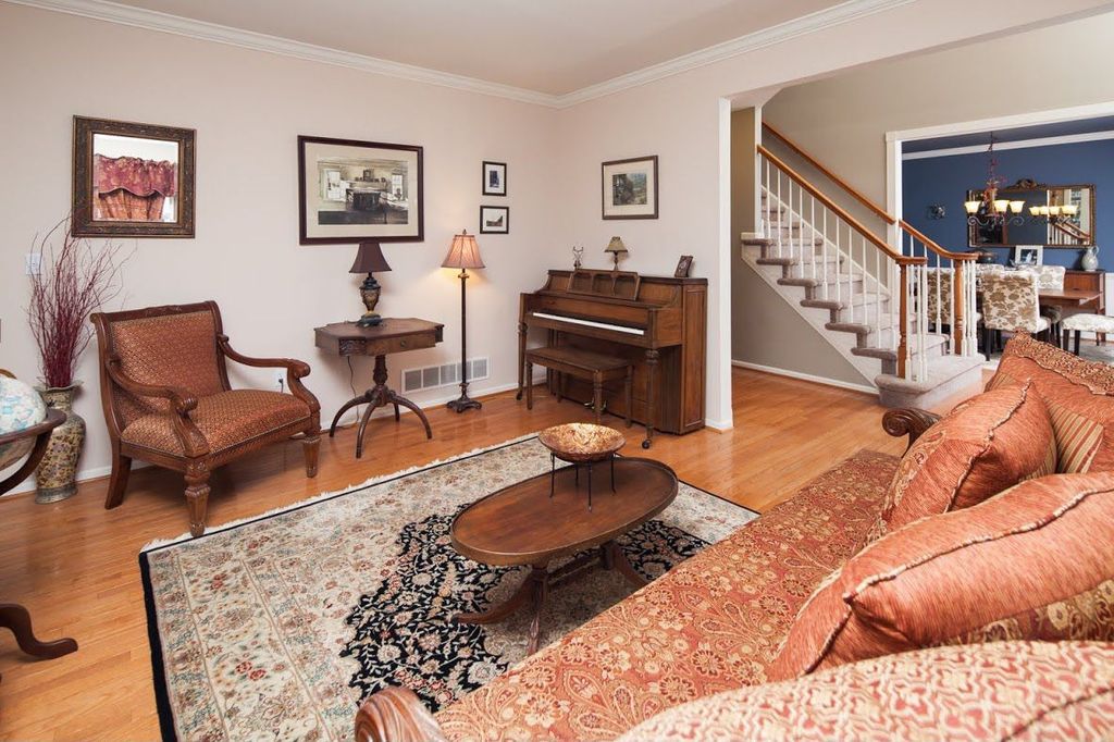 Traditional Living Room with Hardwood floors, Standard height, Crown molding
