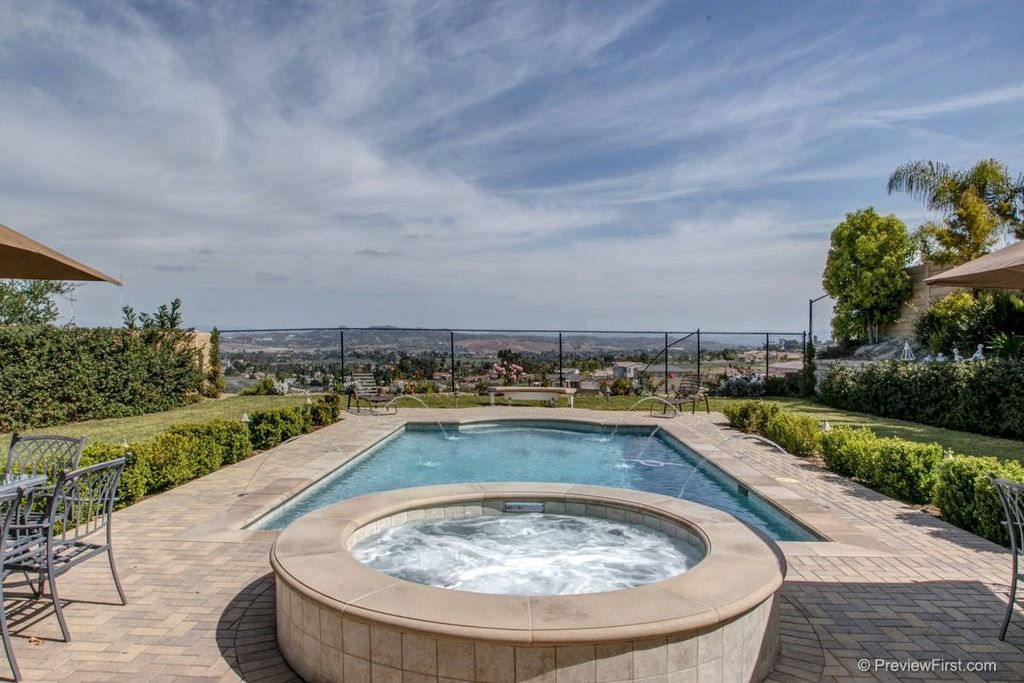 Traditional Swimming Pool with Pool with hot tub, exterior brick floors, Fence