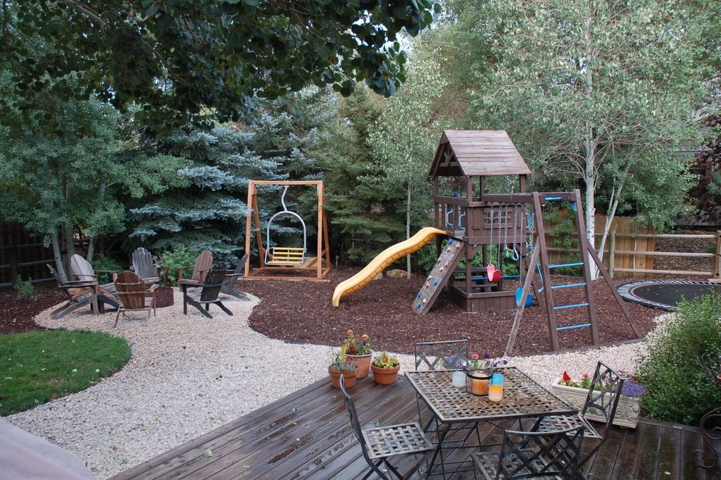 Rustic Landscape and Yard with Raised beds &amp; Fire pit in Park City, UT 