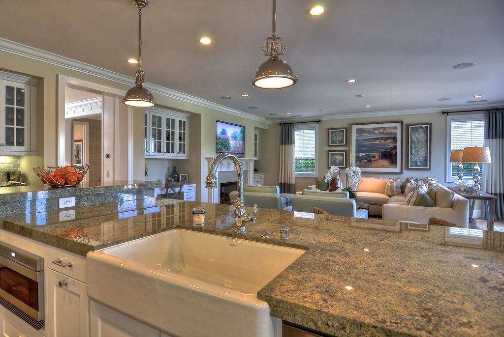 Traditional Great Room with Built-in bookshelf, Pental Custom African Ivory Polished Granite, Crown molding, stone fireplace