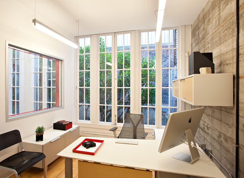 Contemporary Home Office with Modrest Mid-Back Office Chair, interior brick, Hardwood floors