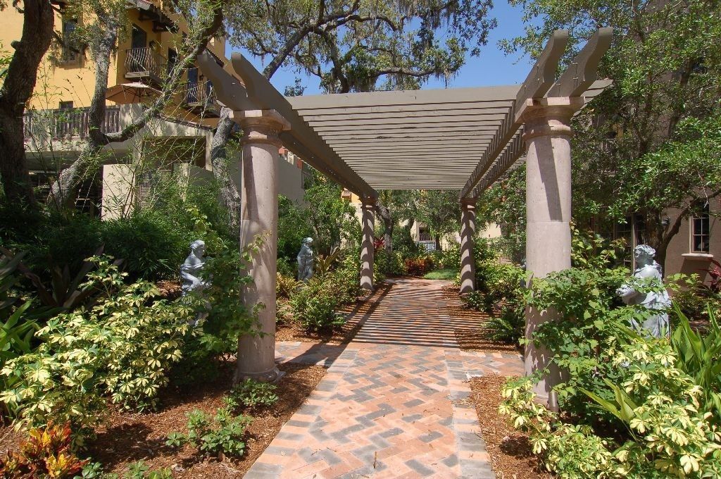 Mediterranean Landscape/Yard with Pathway, exterior tile floors, Trellis, exterior herringbone tile floors