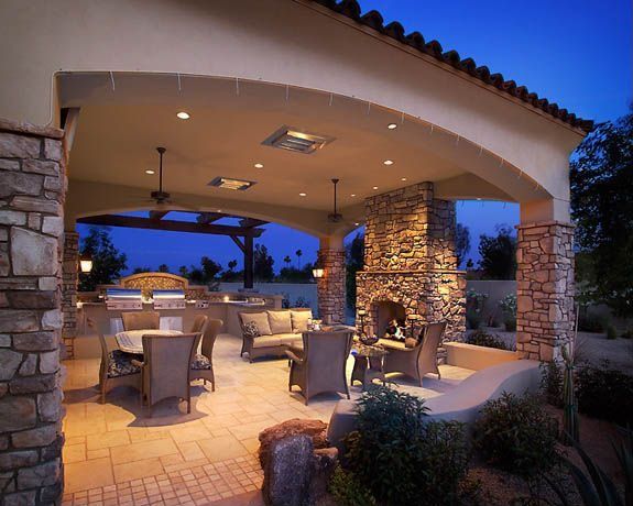 Mediterranean Patio with exterior stone floors, Outdoor kitchen, Fence ...